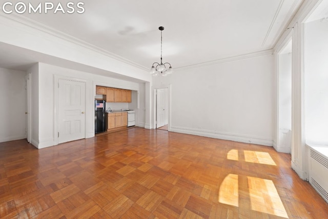 unfurnished living room with crown molding, radiator heating unit, light parquet floors, and a chandelier