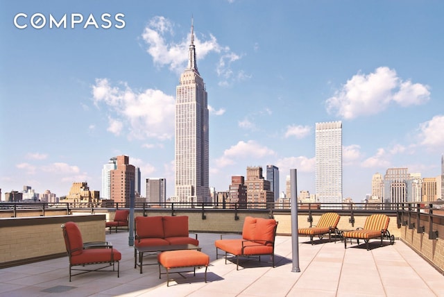 view of patio with a view of city and an outdoor hangout area