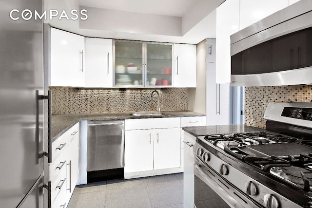 kitchen featuring white cabinetry, sink, and stainless steel appliances