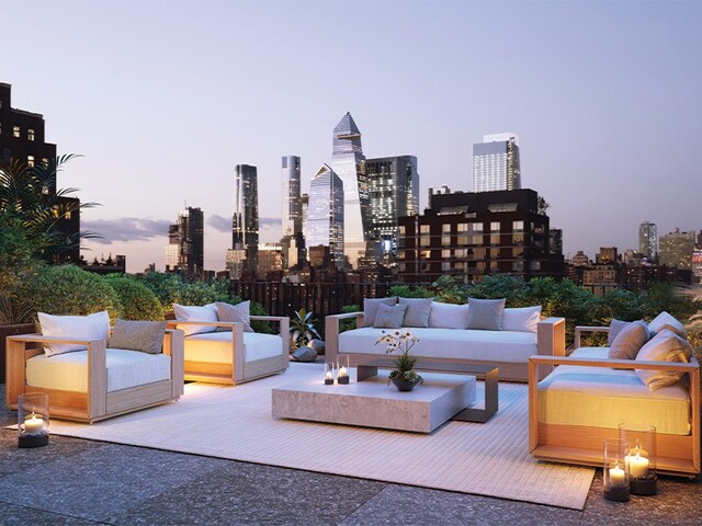 251 W 14th St Unit 9-B, New York City, NY 10011 - patio terrace at dusk with outdoor lounge area