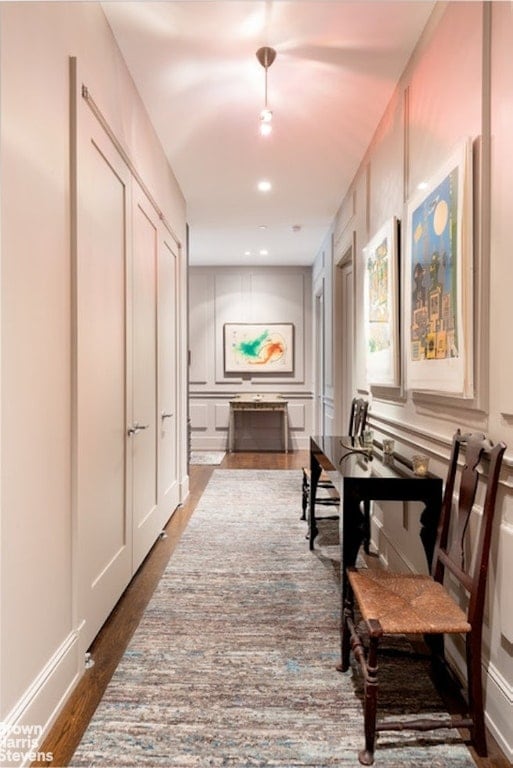 corridor featuring dark hardwood / wood-style floors