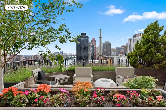 10 E End Ave Unit Ph21D, New York City, NY 10075 - view of patio / terrace featuring a skyline view and a water view