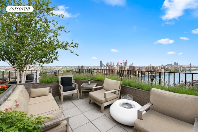 10 E End Ave Unit Ph21D, New York City, NY 10075 - view of patio featuring a water view and outdoor lounge area