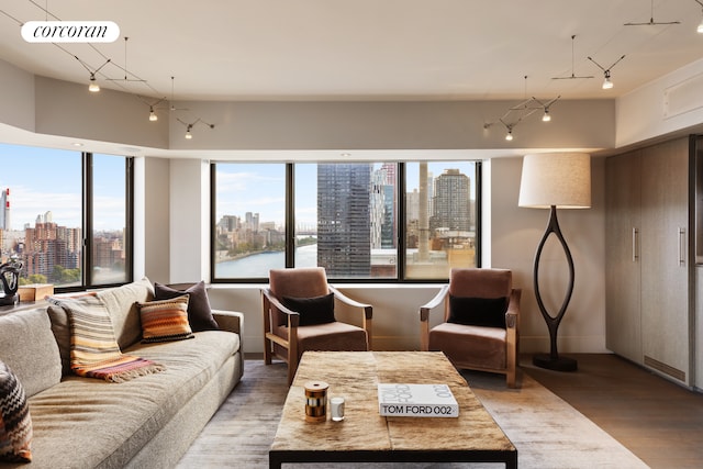 living room featuring a view of city, wood finished floors, and visible vents