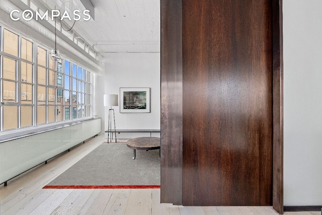 hallway featuring hardwood / wood-style flooring