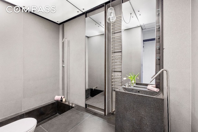 bathroom featuring tile patterned floors and toilet