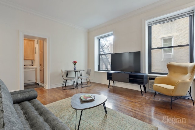 living room with crown molding and hardwood / wood-style floors