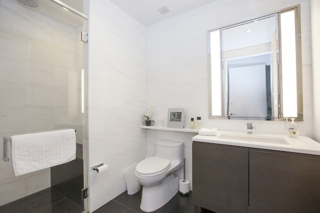 full bath featuring visible vents, tile walls, a shower stall, vanity, and toilet