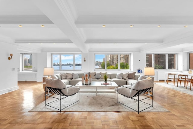 living room with beam ceiling, ornamental molding, and light parquet floors