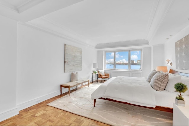 bedroom with a water view, parquet flooring, and crown molding