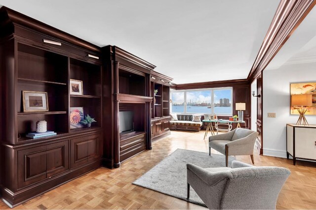 living room with light parquet floors and crown molding