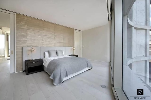 bedroom with light hardwood / wood-style flooring