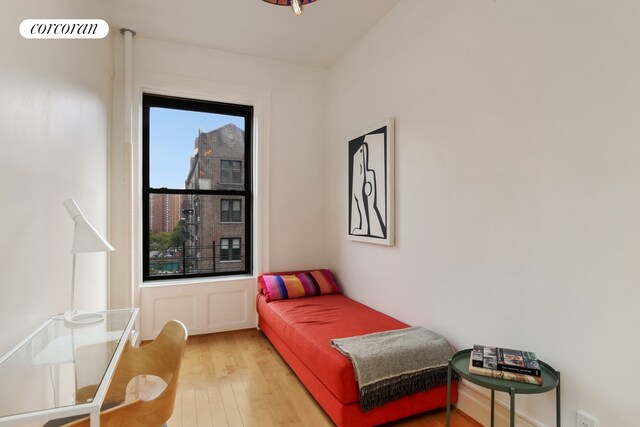 bedroom featuring visible vents and wood finished floors