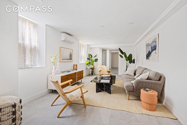 living area with baseboards and a wall mounted AC