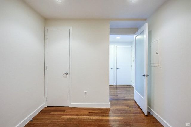 unfurnished bedroom with dark hardwood / wood-style floors