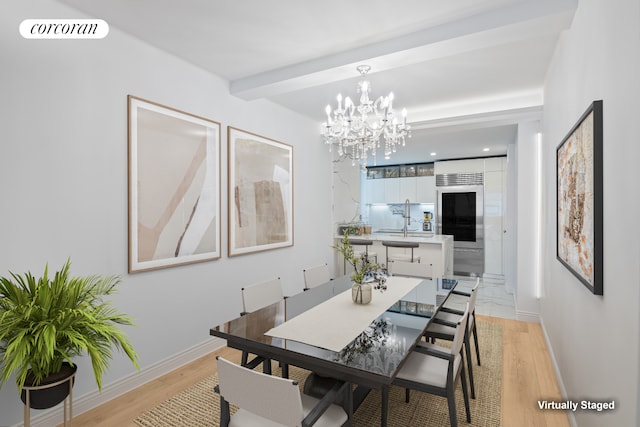 dining space with light wood-style floors, visible vents, beamed ceiling, and baseboards