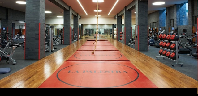 workout area with ornate columns