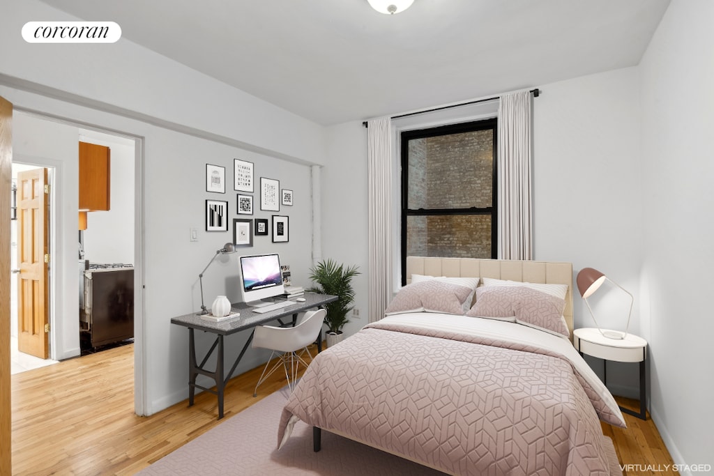 bedroom with light hardwood / wood-style floors