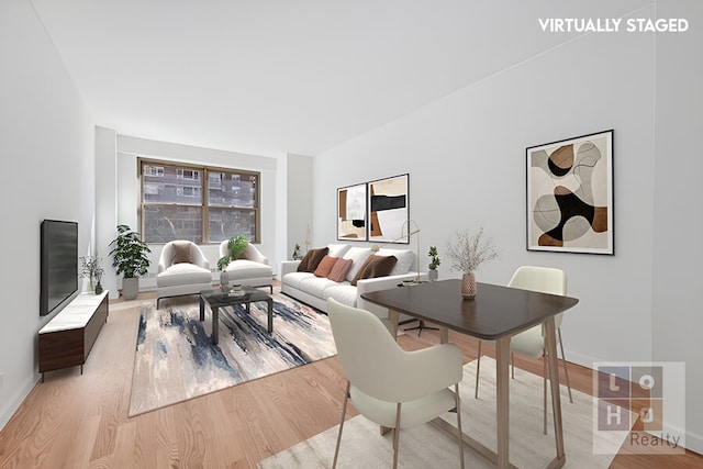 dining room with wood finished floors and baseboards