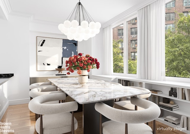 330 E 57th St Unit 3, New York City, NY 10022 - dining space featuring a chandelier, ornamental molding, light wood-type flooring, and baseboards