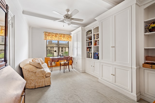 living area with built in features, ornamental molding, a ceiling fan, and light colored carpet