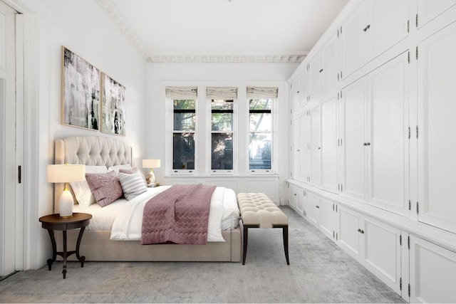 bedroom with light colored carpet