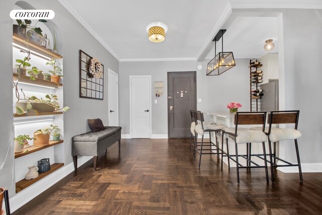 72-11 110th St Unit 4A, New York City, NY 11375 - entryway featuring ornamental molding, baseboards, and a notable chandelier