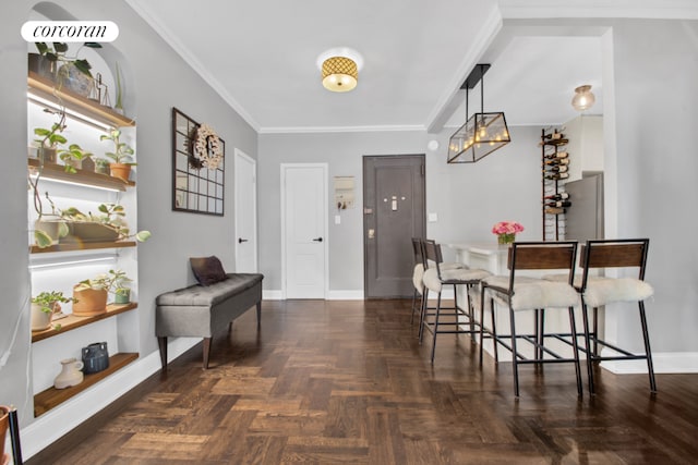 interior space with crown molding and dark parquet flooring