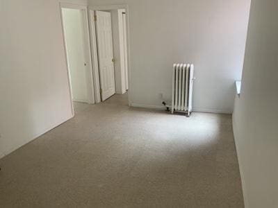 spare room with radiator