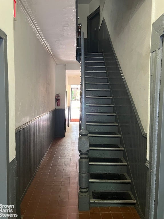 stairs featuring ornamental molding