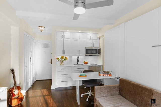 office space featuring sink, dark hardwood / wood-style floors, and ceiling fan