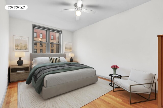 bedroom with hardwood / wood-style floors and ceiling fan