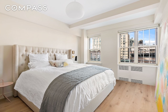 bedroom with wood finished floors