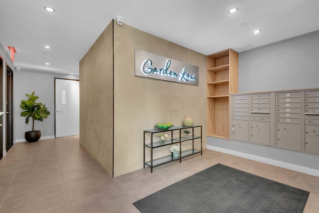 116-17 Grosvenor Ln Unit 2-C, New York City, NY 11418 - building lobby with recessed lighting and a surveillance system