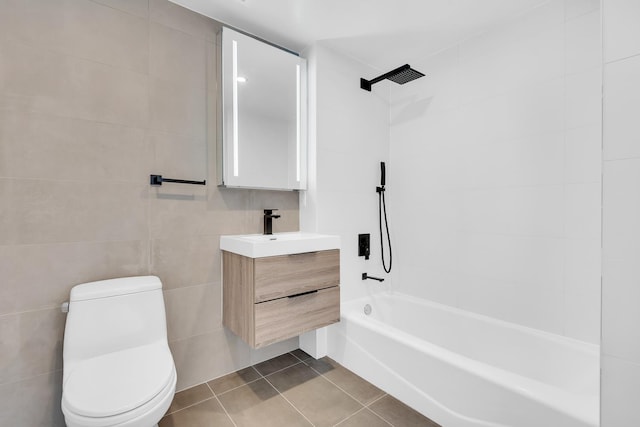 full bathroom with vanity, tile patterned flooring, toilet, shower / bathtub combination, and tile walls