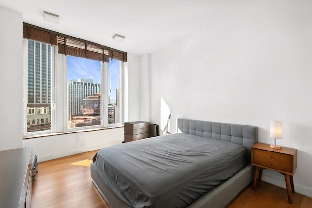 bedroom with light hardwood / wood-style floors