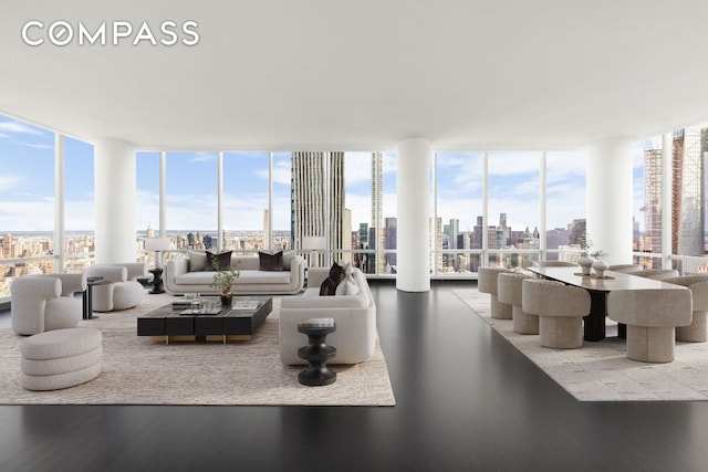 living room with hardwood / wood-style flooring, floor to ceiling windows, and plenty of natural light