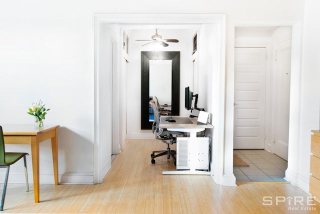 235 E 22nd St Unit 4M, New York City, NY 10010 - home office with a ceiling fan, wood finished floors, and baseboards