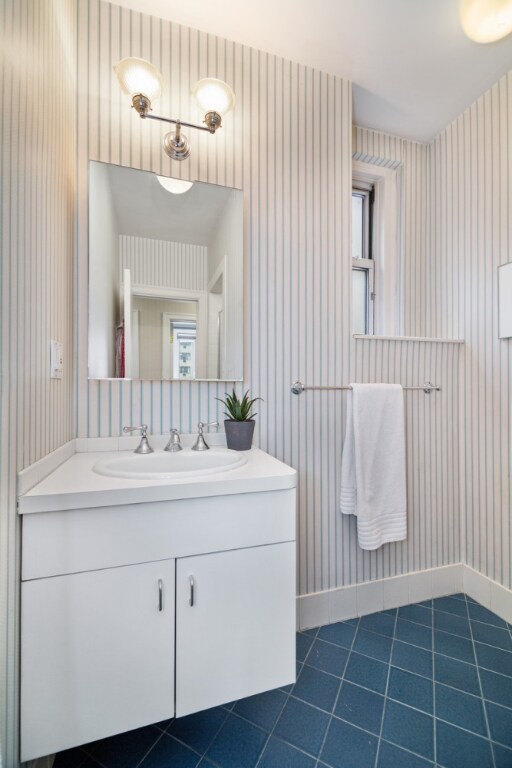 bathroom with vanity and tile patterned floors