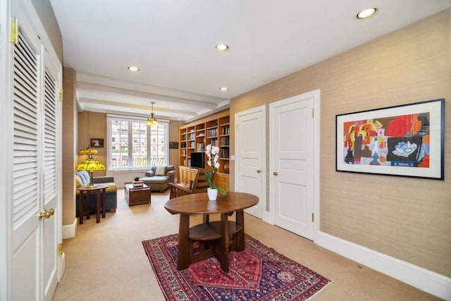 interior space with carpet and beam ceiling