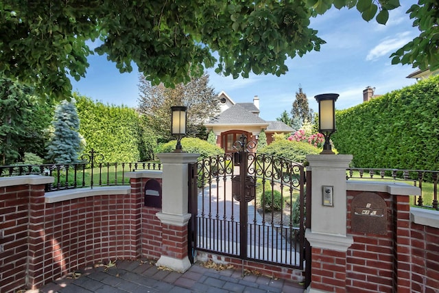 view of gate featuring a fenced front yard