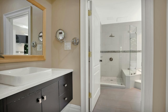 full bathroom with a stall shower and vanity