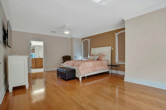 bedroom featuring baseboards, light wood-style floors, and ornamental molding