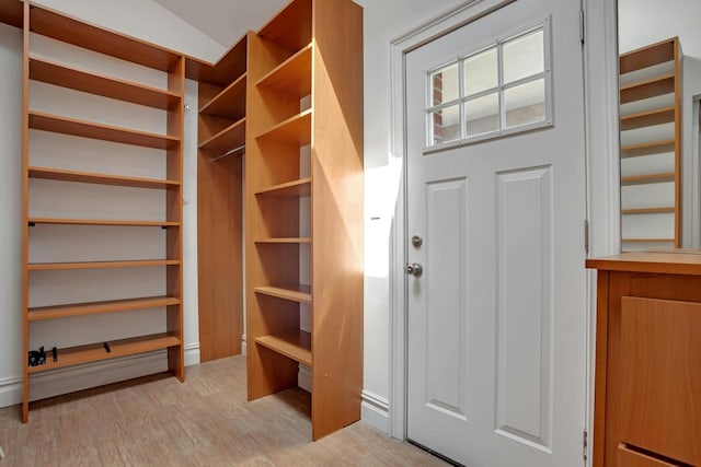 walk in closet featuring light wood-style flooring