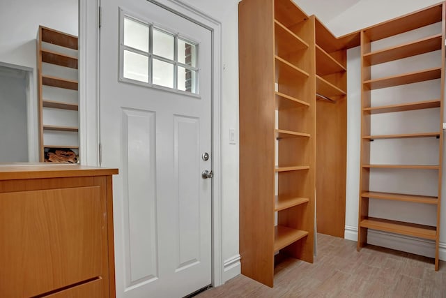 walk in closet featuring light wood-style floors