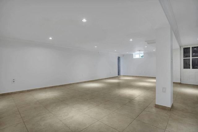 basement with recessed lighting, baseboards, and light tile patterned floors