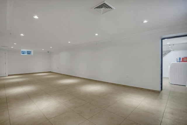 spare room with crown molding, recessed lighting, visible vents, and baseboards