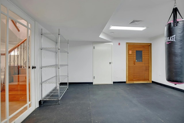 garage featuring visible vents and baseboards