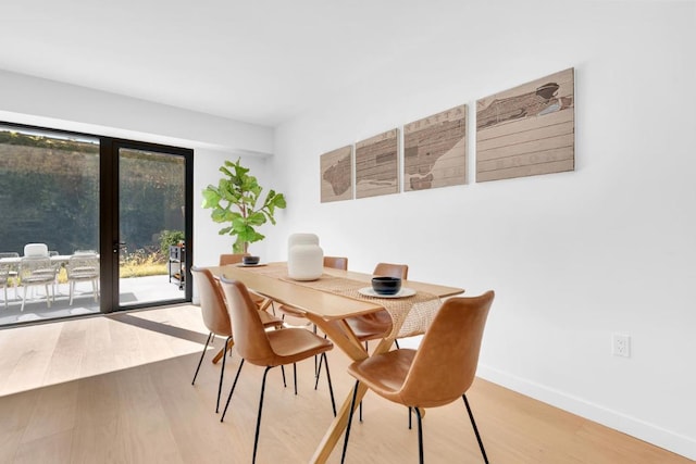 dining space featuring hardwood / wood-style flooring