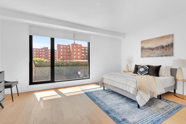 bedroom with light wood-type flooring